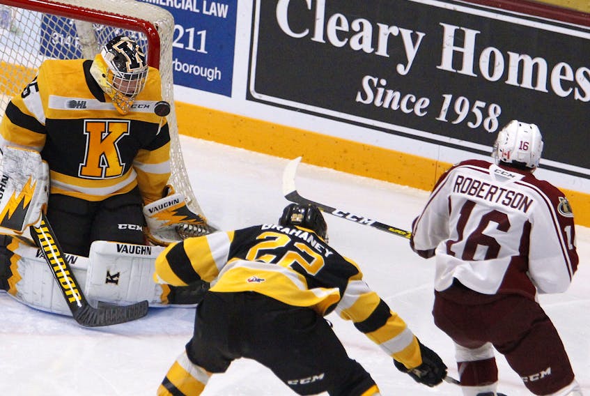 Peterborough Petes' Nick Robertson fires a backhand shot at Kingston Frontenacs' goalie Brendan Bonello . Robertson lea the CHL with 55 goals before the season was called off. Postmedia files