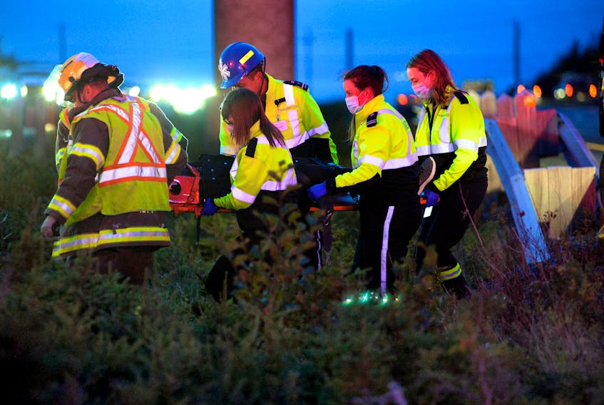 Three people were hospitalized following a two-vehicle collision on Peacekeepers Way Tuesday evening. Keith Gosse/The Telegram