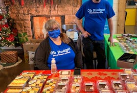 Patricia McLean runs Oh Fudge! P.E.I Potato Fudge in Souris. She has had to change up her business a lot this year and is seen here working her station at Founders Hall’s pop-up market with employee Mike Wallis. Noah McNeill/The Guardian