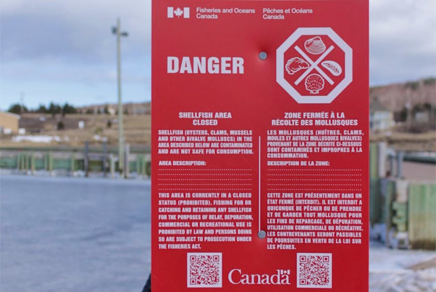 The Department of Fisheries and Oceans posts signs like this one to alert shellfish harvesters when an area is closed due to toxins or contaminated shellfish. 