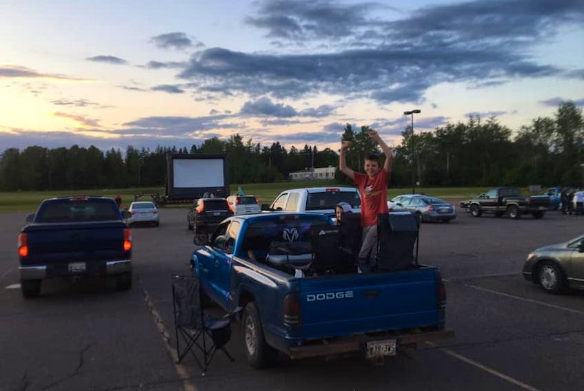 Movie-goers enjoy a night at Dash's Drive-In in Montague on July 4.