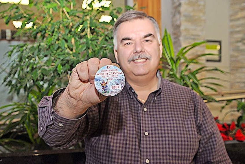 Corner Brook Mayor Charles Pender displays the 2016 Corner Brook Winter Carnival button.