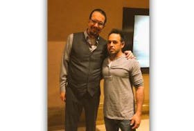 ['American magician and comedian Penn Jillette poses for a photo with Newfoundland actor and comedian Shaun Majumder.']
