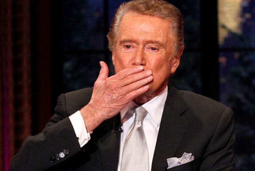 Television host Regis Philbin blows a kiss goodbye during his final show of "Live With Regis and Kelly" in 2011.
