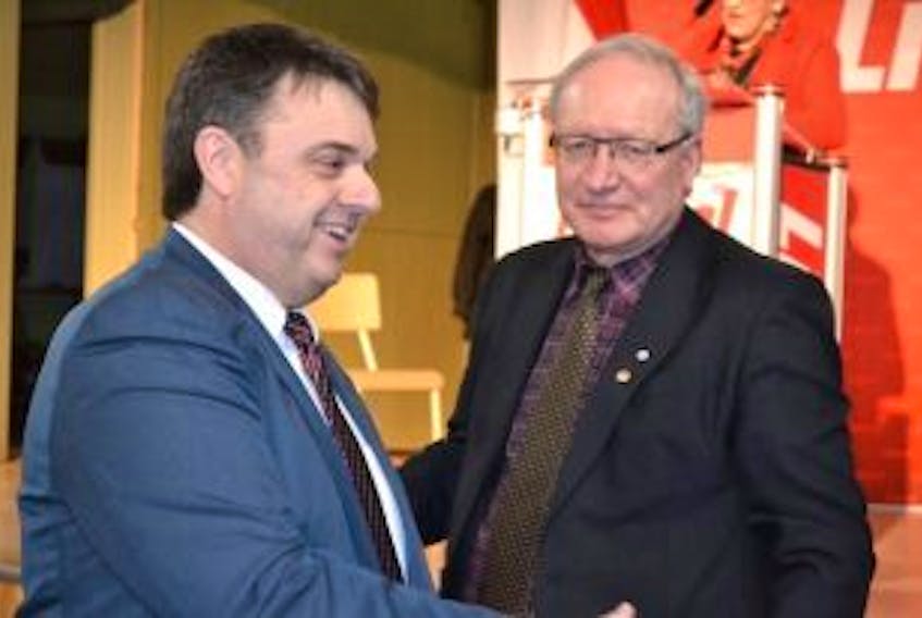 ['<p>P.E.I. premier Wade MacLauchlan looks on as Hal Perry, newly nominated Liberal candidate in District 27, reaches out to voters Tuesday night in Tignish. He won the party’s nomination over Neil LeClair.</p>']