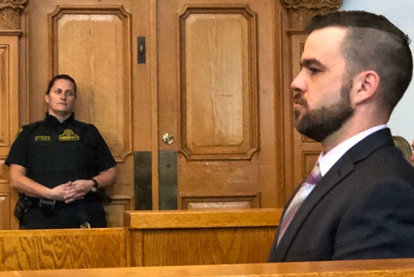 Philip Butler, 38, sits in the prisoner's box as his second-degree murder trial gets underway Monday in Newfoundland and Labrador Supreme Court in St. John's. Butler is charged with the May 2018 murder of his older brother, George. Tara Bradbury/The Telegram