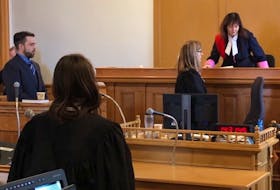 Philip Butler stands in the witness box as Justice Valerie Marshall takes her seat at the bench for the continuation of his second-degree murder trial in St. John’s Monday. Tara Bradbury/The Telegram