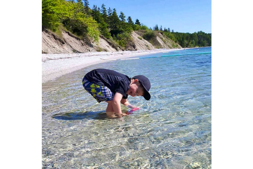 Beach time at Marble Mountain, Cape Breton, N.S! Five-year-old Liam MacKinnon has the right idea: the best way to beat the heat is to get in the water and play.