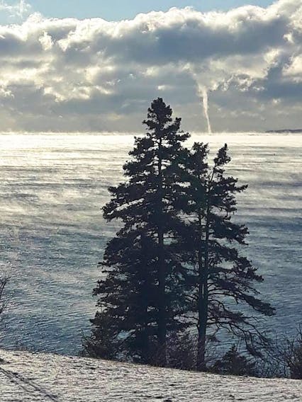 Steam rising off the water on a cold January day... not uncommon.  A winter waterspout... priceless.  Gloria Nickerson-Brown spotted the spout last weekend in Beaver Harbour, N.B.
