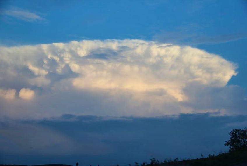 Darlene McIntosh of Glassville, N.B., was happy to be on the dry side of this cumulonimbus cloud Aug. 6.