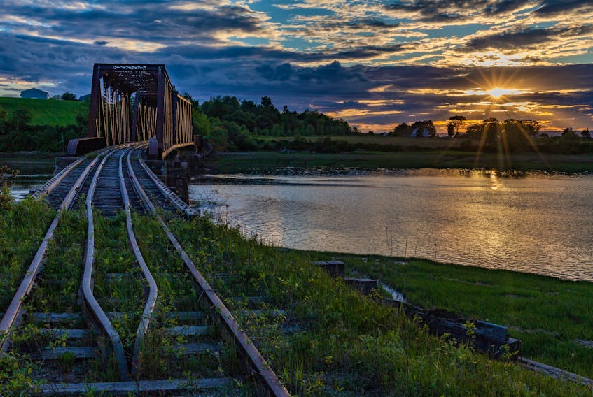 The old rail bridge over the Gaspereau River near Avonport, N.S., always takes a lovely photo.  Barry Burgess snapped this one as the late day sun was peeking through a mix of sun and clouds (not cloud!).