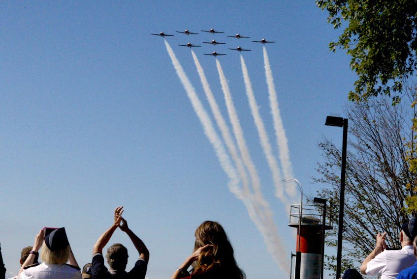Spectators cheer as the Canadian Forces Snowbirds fly past Blockhouse Island.