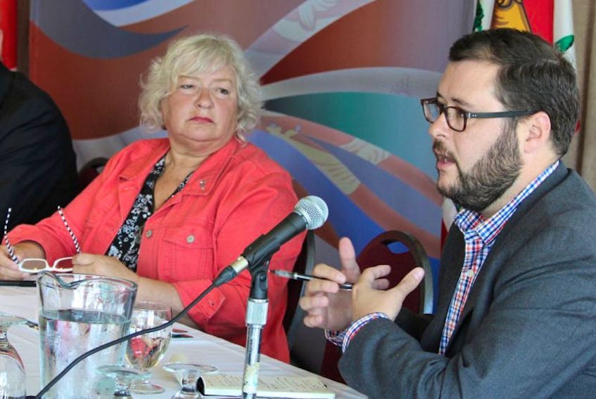 John Kimmel, right, talks during the panel discussion at the recent economic forum put on by the provincial government while fellow panellists, David Dunphy, left, and Audrey Shillabeer listen. 
