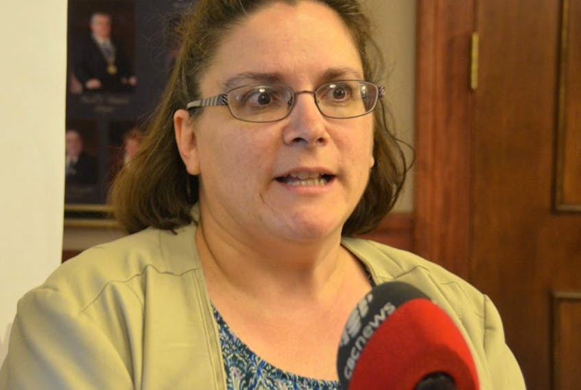 Giselle Babineau-Jordan, chairwoman of the board for Centre Belle-Alliance, speaks with reporters Monday evening after proposing closer ties between her organization and the City of Summerside.