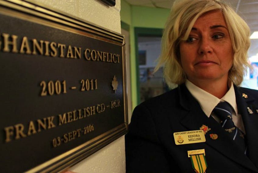 Kendra Mellish looks at the plaque honouring her late husband, Warrant Officer Frank Mellish who was killed in the Afghanistan conflict on Sept. 3, 2006. 