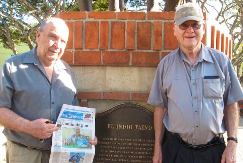Blair Strongman, left, of Summerside and Bruce Cotton brought the Journal Pioneer to San Juan, Puerto Rico, recently. This particular edition of the Journal featured Strongman on the front page.