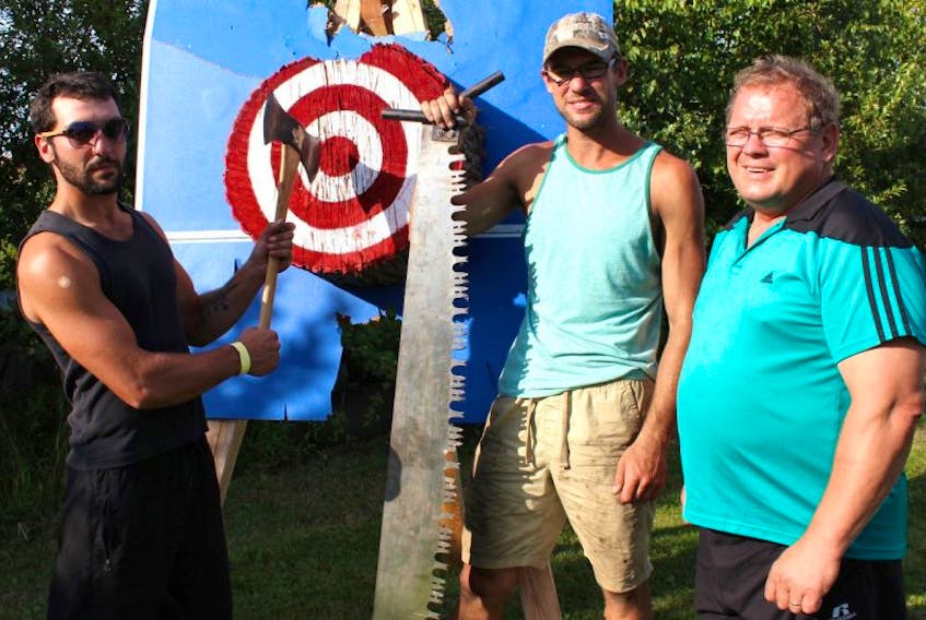 From left, competitors Joey and Mathieu Arsenault and organizer Edgar Arsenault are gearing up for the Woodsmen Competition, returning to the Evangeline Area Agricultural Exhibition and Acadian Festival Sunday, Sept. 3, at 11:30 a.m. Eight men will compete in five different contests to earn cash and merchandise prizes.