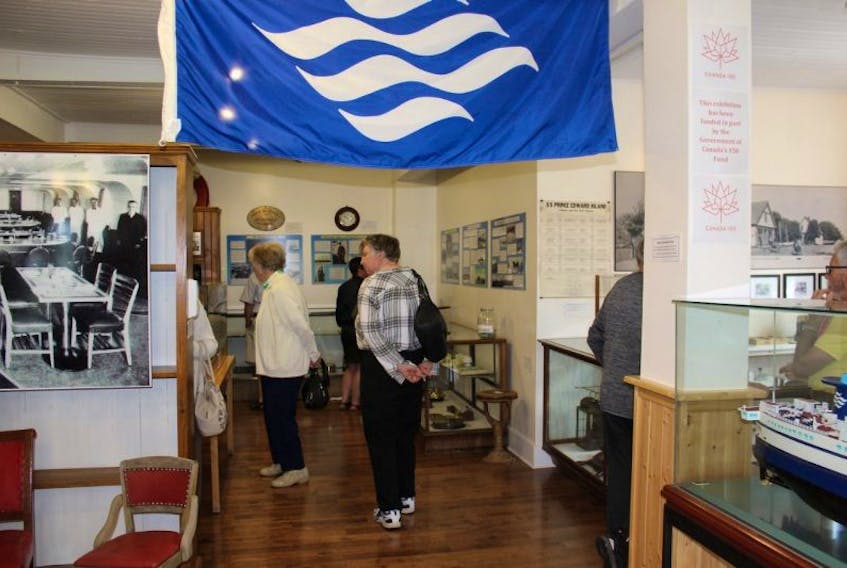 Some of the many people who visited the Bedeque Area Museum on its special open day on Sunday August 27, view the exhibit marking the centenary of the beginning of the ferry service from Borden to Cape Tormentine.  