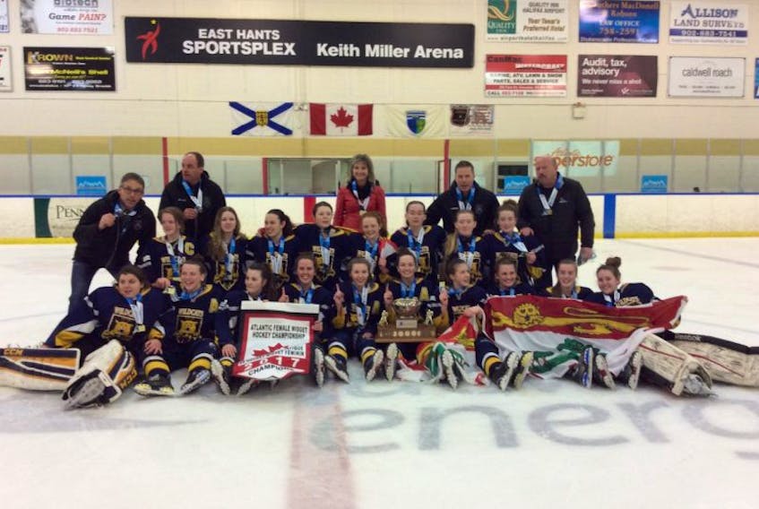The Mid-Isle Wildcats celebrate after winning the Atlantic midget AAA female hockey championship in Lantz, N.S., on Sunday afternoon. The Wildcats defeated Nova Scotia’s Northern Subway Selects 2-0 in the championship game. Team members are, front row, from left: Danielle Gallant, Kennedy Francis, Tait Tierney, Jacqueline Mix, Alexis Mulligan, Taylor Gillis, Paige Deighan, Madison Vincent, Maggie Linkletter and Maggie Johnston. Second row: Makayla Larsen, Mya Wood, Keiran Andrews, Lexie Murphy, Caissie Doiron, Madeline Hamill, Kelsey Weeks and Mya Chisholm. Back row: Kevin Andrews, head coach; Shane Hamill, assistant coach; Kellie Mulligan, manager; David Chisholm, assistant coach, and Mike Hammill, Hockey P.E.I. female rep. Missing from photo is assistant coach Ferran Brown.