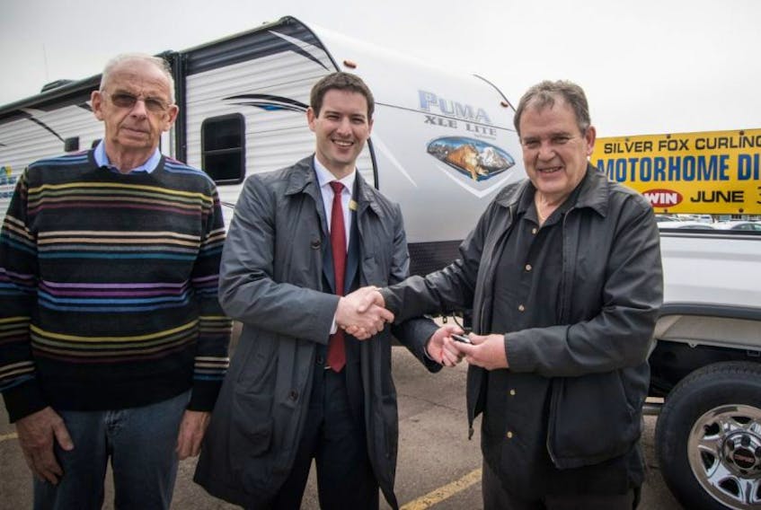 Taking part in the kickoff of the annual event were Adam Toner, Township Chev Buick GMC, presenting the Keys to the 2017 GMC Sierra to Gordon Lapp, General Manager of the Silver Fox Entertainment Complex. Looking on is Ken Moase of the Travellers Rest RV Centre.