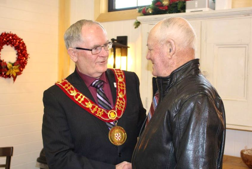 Kensington Mayor, Rowan Caseley, greets Alton Ramsay at the annual town levee held at Broadway 45 in Kensington on Sunday. Ramsay was one of many who attended the annual event.