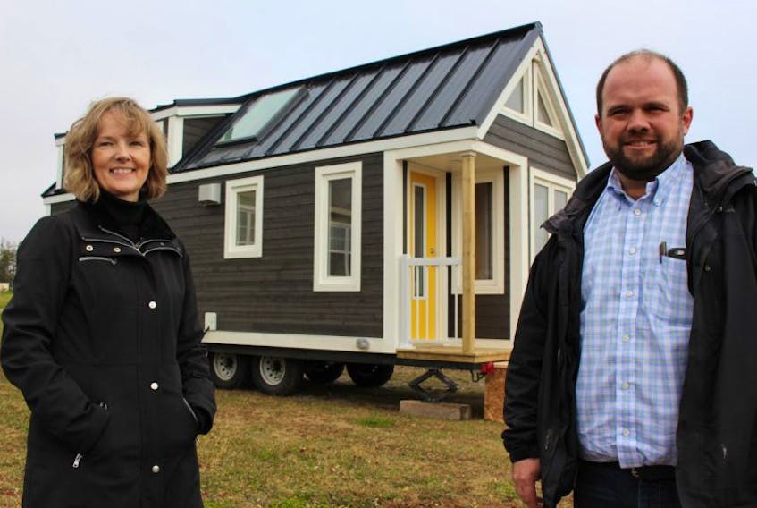 Lisa DesRoches and Brent Lewis stand outside a micro-home dubbed “The Haven”. Tiny homes, as they are known, are growing in popularity, with communities of them popping up across North America.