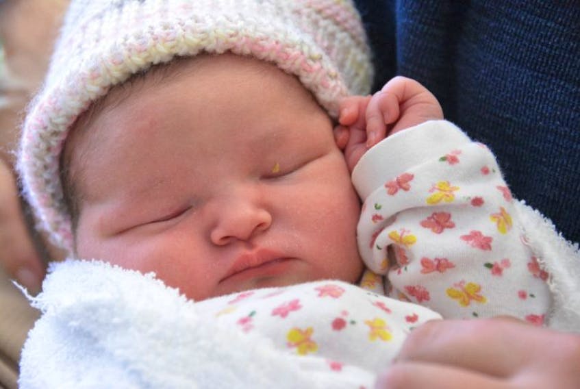 Baby Rice sleeps in her father’s arms only hours after being born at Prince County Hospital. Baby Rice, whose forever name hasn’t been chosen yet, was the first baby born in the hospital in 2017, arriving at 10:52 p.m. Tuesday evening. Her parents are Nancy Manderson and Stephen Rice.