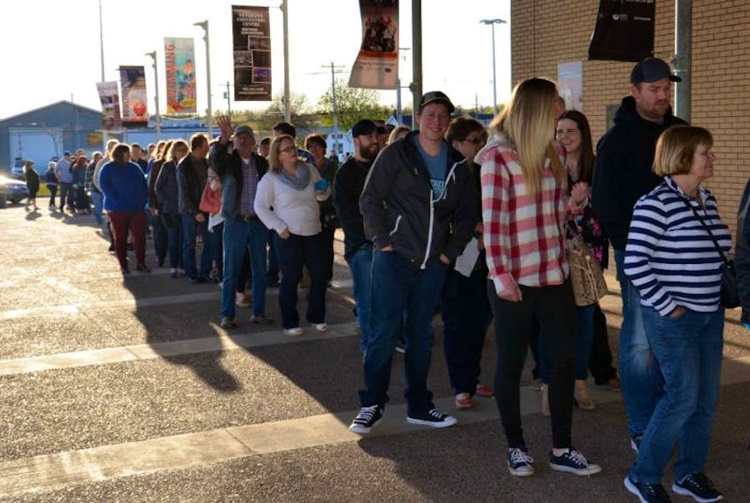 A growing line of excited Travis Tritt fans at Summerside’s Credit Union Place Saturday evening.
