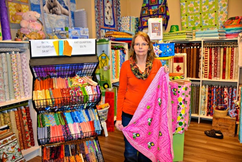 Faith LeClair transformed her garage, located on 18 Andrews Drive in Kensington, into a fabric store called “Sew Blessed Quilters.”