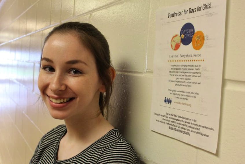 Rachel Adams with the Days for Girls poster she made promoting her community event at the Borden-Carleton Public Library. Participants will be cutting fabric that will be used to make sustainable feminine hygiene products that will be sent to Kenya.