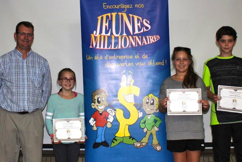 At the recent closing night for the 2017 jeunes millionnaires program in Abram-Village. From left are Stéphane Blanchard, who handed out certificates to three of the participants: Jane Carragher from The Doggy Den/Le Salon de chiens, Gabrielle Gallant from "Emily and Gabrielle's Arts and Tie-Dye" and Jaden McInnis from Yeti's Freezies.