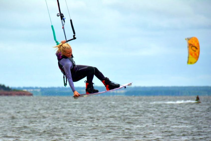 Lauren Holman, from Vancouver, touches the sky with her kiteboard in Malpeque Bay. “It’s not just a good pastime, but good to do with friends, brings people closer and creates a community. Plus, I love seeing my dad and mom learn, as well as my whole family,” she said with a grin.
