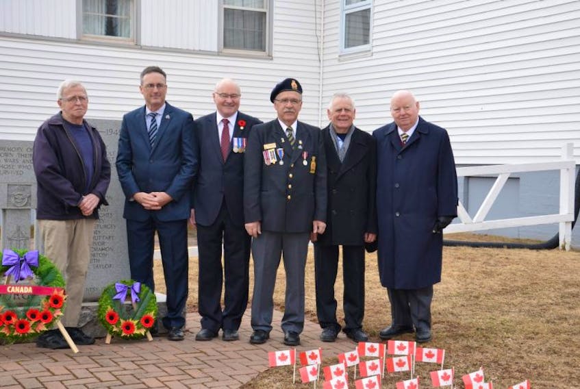 Gene Rogerson (left) the nephew of Pte. John Lyman Wood, who survived the four-day battle at Vimy, stands in front of the Borden-Carleton cenotaph, along with Official Opposition Leader Jamie Fox, Malpeque MP Wayne Easter, Comrade Mitch MacDonald from the Borden-Carleton Legion, Borden-Carleton Mayor Dean Sexton, and Senator Mike Duffy.