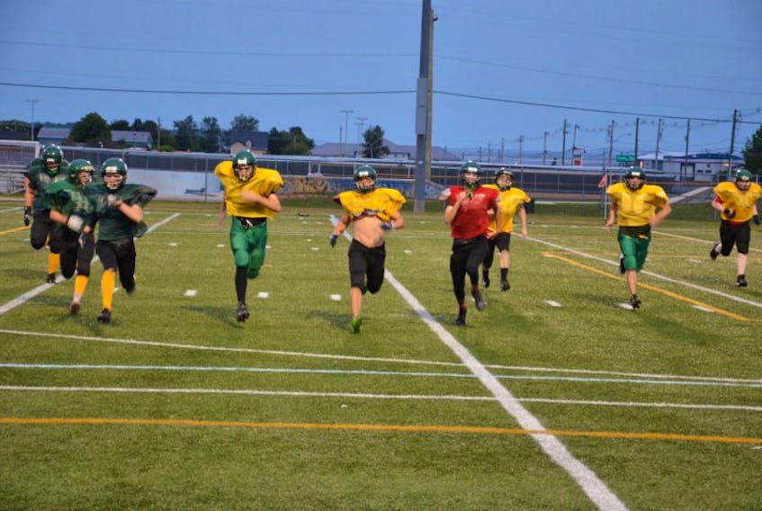 The Summerside Cooke Insurance Clippers participate in a running drill during a recent practice at Eric Johnston Field. The Clippers are the defending P.E.I. Varsity Tackle Football League champions.