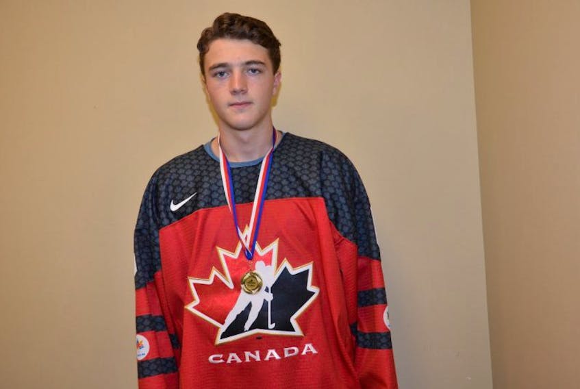 Noah Dobson of Summerside won a gold medal with Team Canada’s under-18 hockey team at the 2017 Ivan Hlinka Memorial Cup in the Czech Republic on Saturday. Dobson returned home late Sunday night.