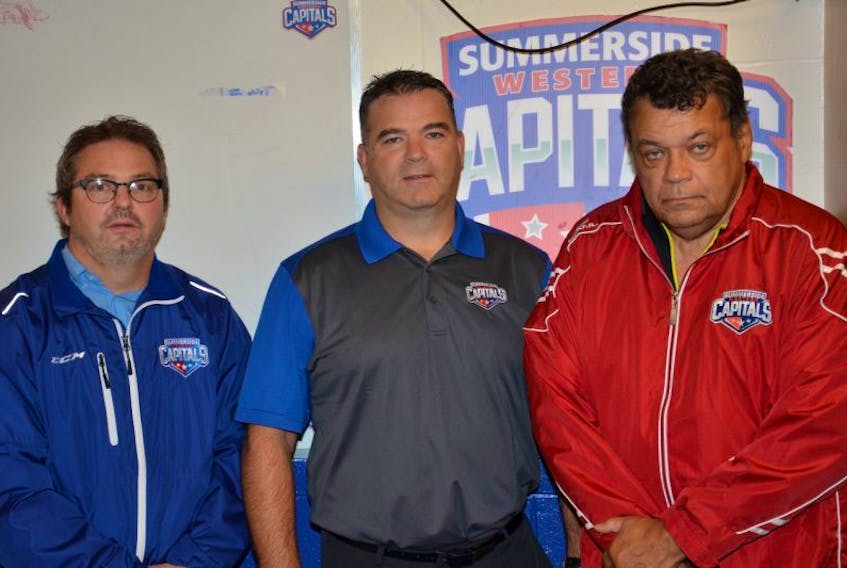 Jason (Lefty) Gallant, left, of Summerside is the newest member of the Summerside D. Alex MacDonald Ford Western Capitals’ coaching staff. Gallant discusses the start of Monday’s training camp with head coach Billy McGuigan, centre, and strength and conditioning coach Joe Borden.