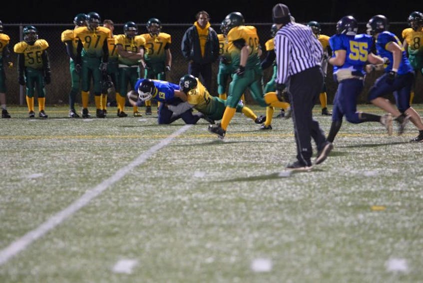 Brayden Lawless, 51, of the Summerside Cooke Insurance Clippers tackles the Cornwall Timberwolves’ Andrew Cane during Friday night’s Papa John’s P.E.I. Varsity Tackle Football League game at Eric Johnston Field in Summerside. The Clippers won the contest 39-8.