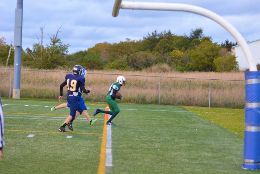 Ethan Haakman scores a touchdown for the Summerside Waterwise Spartans late in the first half of Friday night’s Papa John's P.E.I. Bantam Tackle Football League game at Eric Johnston Field. The Cornwall Timberwolves, led by quarterback Tyler Newson’s three touchdowns, defeated the Spartans 22-14.