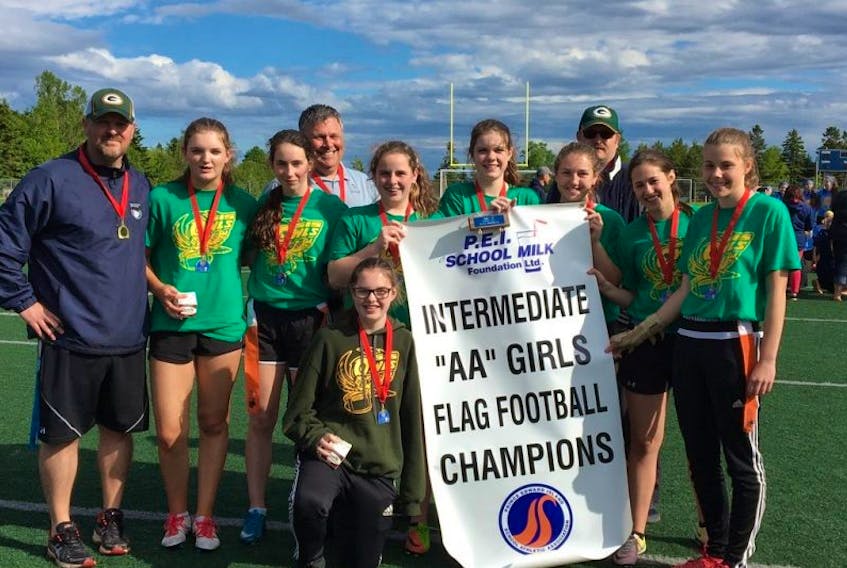 The Summerside Intermediate School Packers defeated the Summerside Intermediate School Chargers 26-6 in the P.E.I. School Athletic Association AA Girls Flag Football League championship game in Cornwall recently. Members of the Packers are, front row: Hilary Gaudet. Middle row, from left: Trevor Bridges (coach), Mallory Doucette, Megan Rodgers, Brianna McCardle, Lydia Hemphill, Maggie Johnson, Sydney Gallant and Natalie Caron. Back row: Mark Ronahan and Dominique Valle.