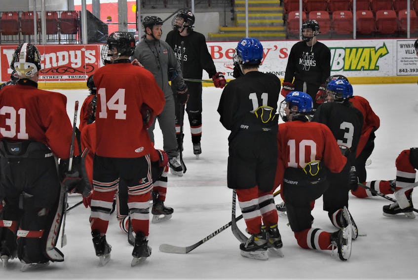Pictou County Major U-18 Weeks’ head coach Kyle MacLennan addresses his team to conclude a recent practice at the Rath Eastlink Community Centre. A young team this season, the Weeks include players from Colchester and Cumberland counties as well as Pictou County. 