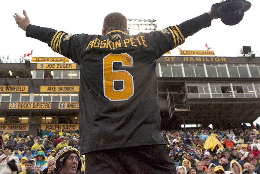 Dan Black, aka Pigskin Pete, whips up the Hamilton Tiger Cats fans before their game against the Winnipeg Blue Bombers at Ivor Wynne Stadium in Hamilton on Saturday October 27, 2012. (THE CANADIAN PRESS/Chris Young)