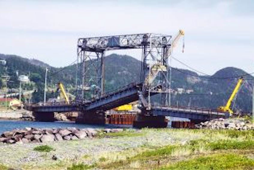 ['The Placentia lift bridge was out of commission on Aug. 4 and government officials were trying to get it fixed after a mechanical failure left it hanging at an angle. — Photo by James McLeod/The Telegram']