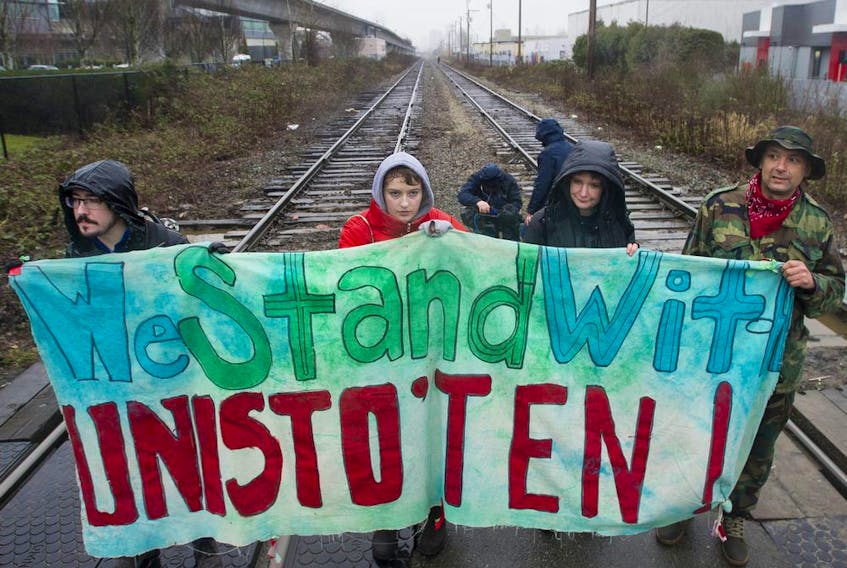  Approximately 100 people march in support of the Wet’suwet’en hereditary chiefs in their opposition to the GasLink pipeline project, along Grandview Highway in Vancouver Saturday, February 15, 2020. The protestors occupied the railway crossing on Renfrew Street between Grandview and Hebb Street.