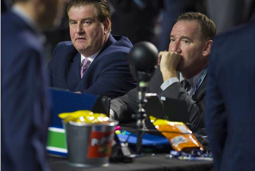 Vancouver Canucks GM Jim Benning and AGM John Weisbrod before the start of Round 1 of the 2019 NHL Draft at Rogers Arena, Friday, June 21, 2019.