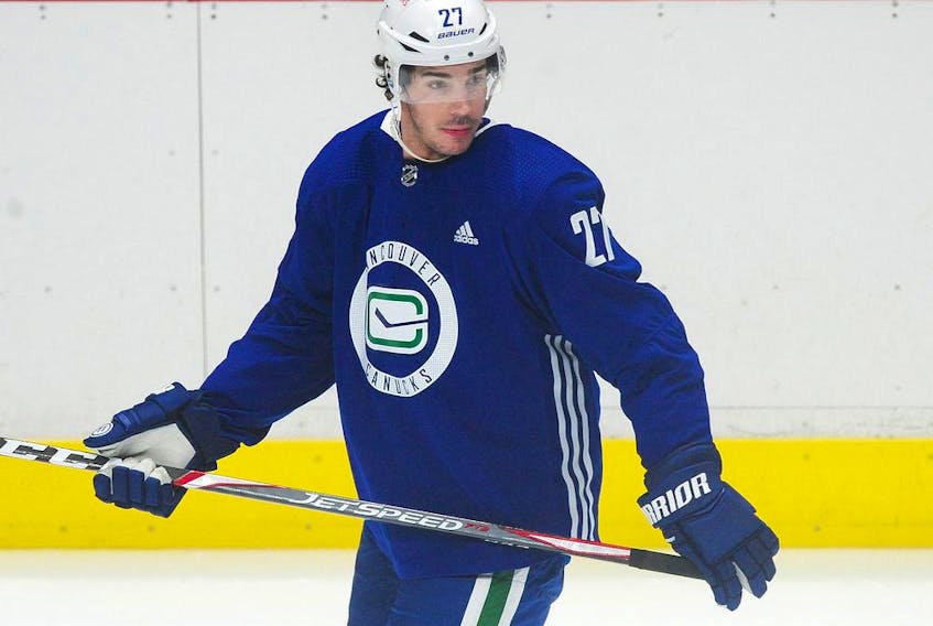 Travis Hamonic on the ice during the Canucks training camp at Rogers Arena earlier this month. Hamonic is dealing with an ‘upper-body injury’ after Wednesday’s regular season opener against Montreal, Canucks GM Jim Benning said Thursday.