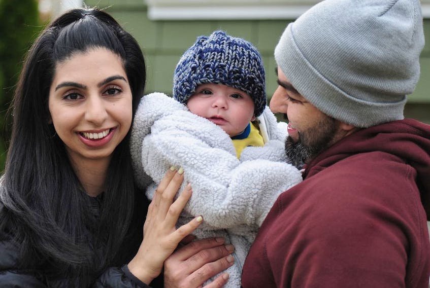 Japleen Gill, with baby Jeevan and her husband, Gaurav, at home in Vancouver on March 4.