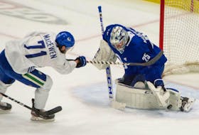 Zack MacEwen fires a shot on Jacob Markstrom during a Vancouver Canucks practice at Rogers Arena this week.

