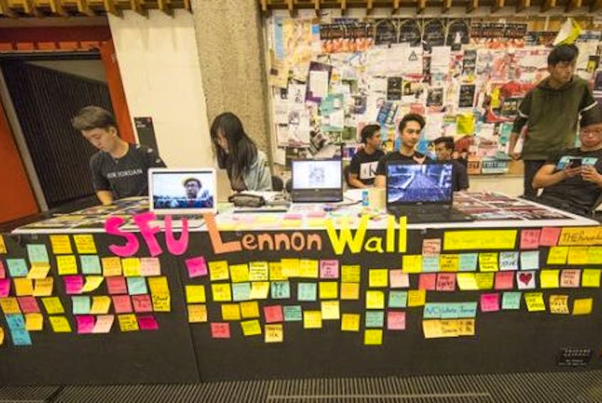  The second Lennon Wall, established Wednesday, on the Simon Fraser University campus. The original Lennon Wall, located outside the main Bennett Library, was ‘repeatedly destroyed and rebuilt, with post-it notes taken down. It’s gone for now,’ says Joel Wan of Vancouver Hong Kong Political Activists.