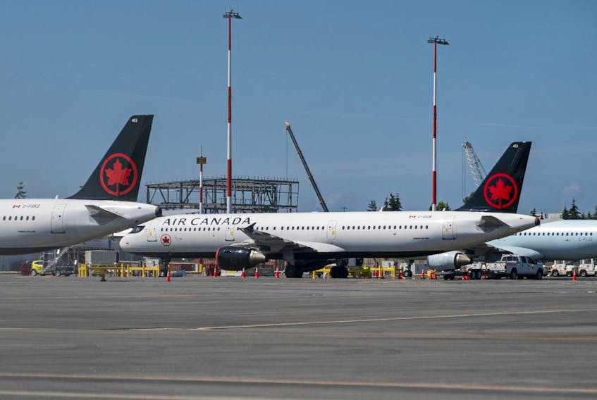 Air Canada planes sit parked at Vancouver International Airport