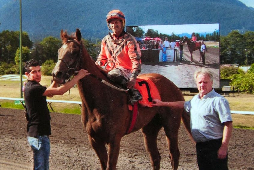  Mexican stable worker David (left), one of several people who were arrested Monday at the stables of Vancouver’s Hastings Racecourse, with trainer Craig MacPherson (right) and an unidentified jockey on a race-winning horse in Vancouver in an undated photo.